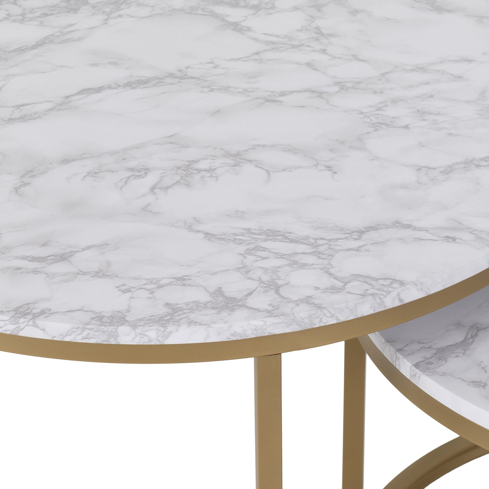 Round marble table with gold legs on a white background