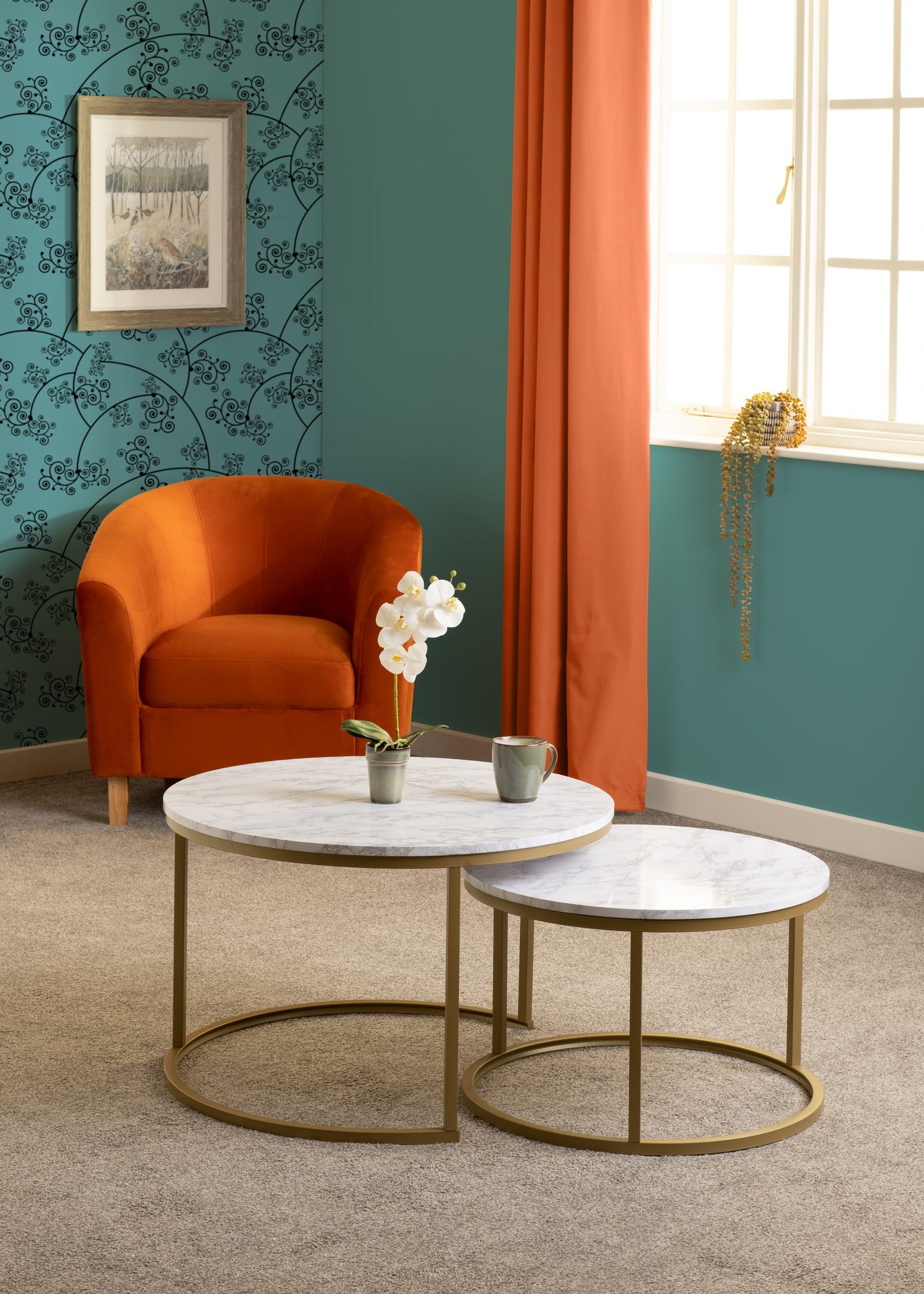 Living room with orange armchair, marble coffee table, and decorative elements.