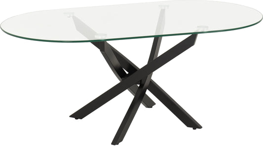 Glass dining table with black metal legs on a white background