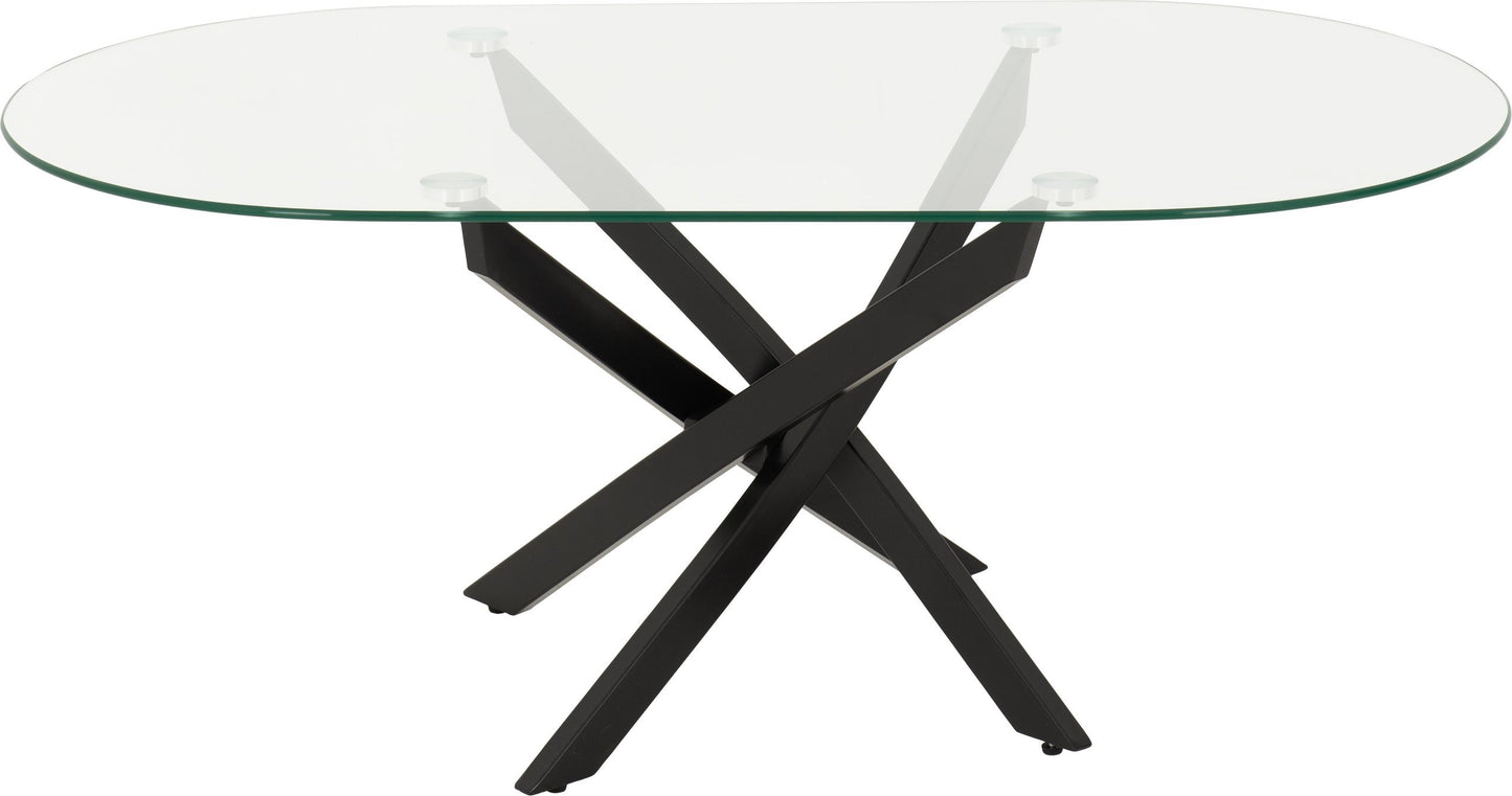 Glass dining table with black metal base on a white background