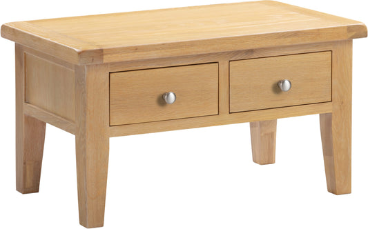 Wooden coffee table with two drawers on a white background