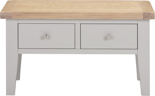 Light gray console table with two drawers and a wooden top on a white background