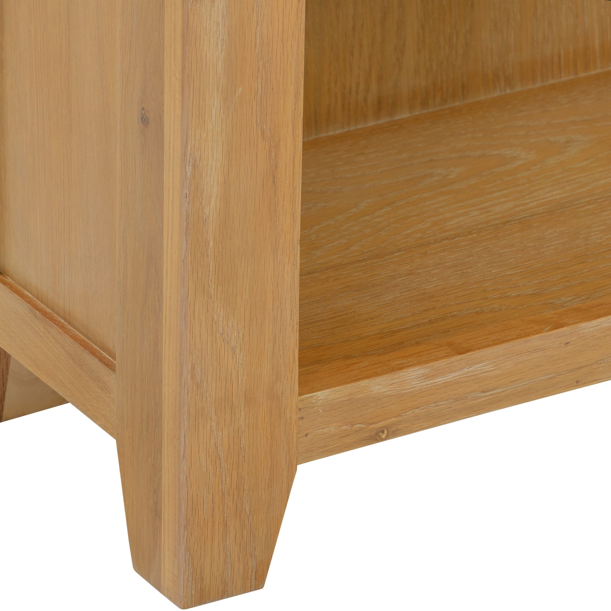 Close-up of a wooden cabinet corner on a white background