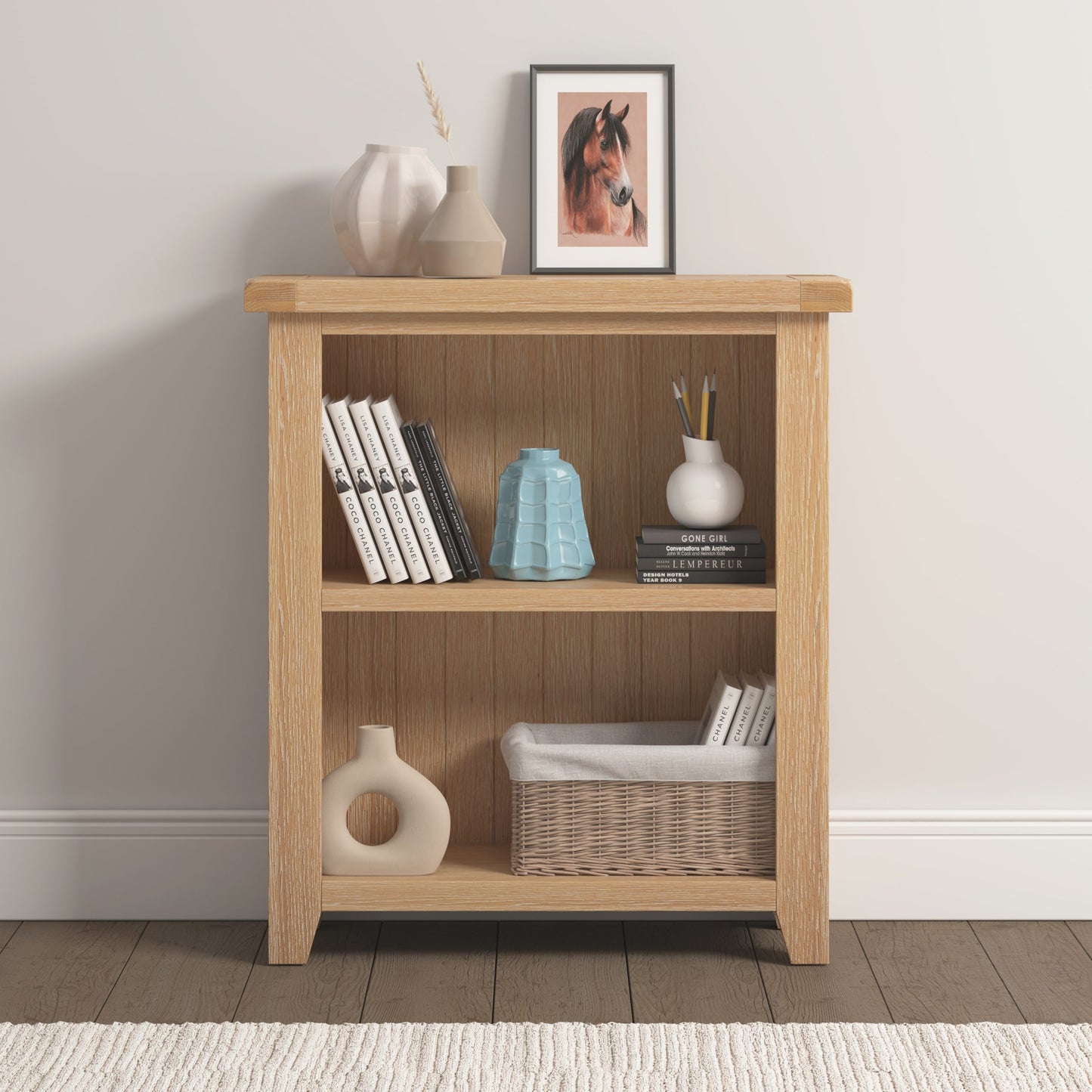 Wooden bookshelf with decorative items against a plain wall