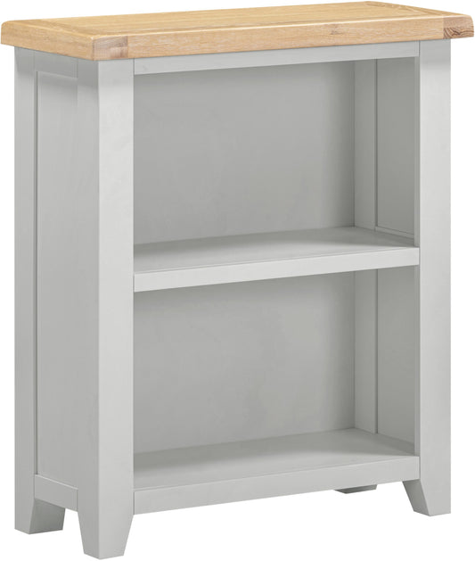 Small bookshelf with a light gray finish and wooden top on a white background