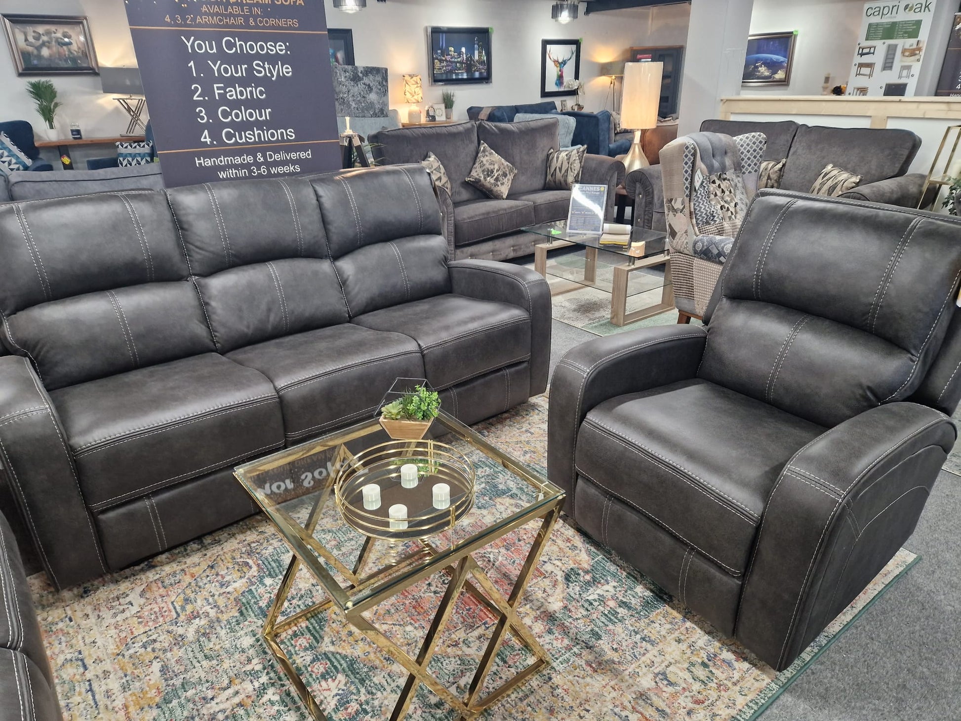 Grey Fabric recliner sofa with recliner in a showroom setting