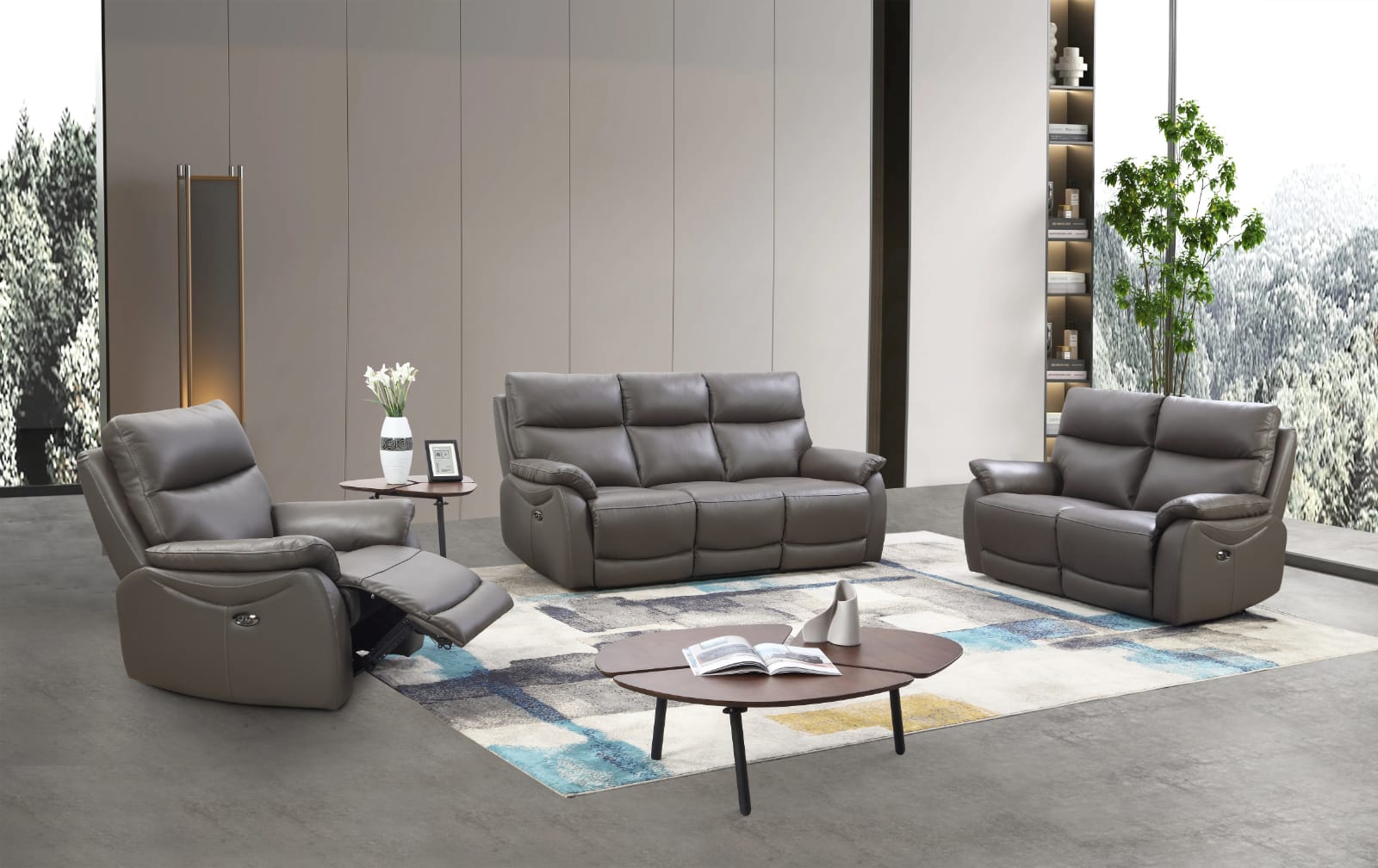 Gray leather power recliner sofa set in a modern living room with a coffee table and decor items.