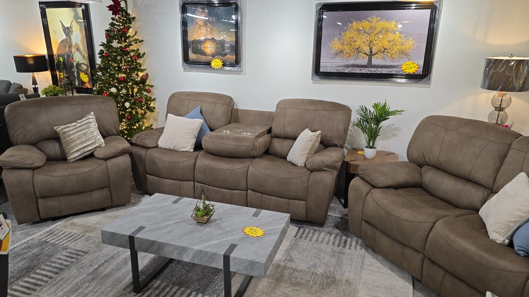Sandstone Fabric recliner sofa set in a living room with Christmas decorations and framed pictures on the wall.