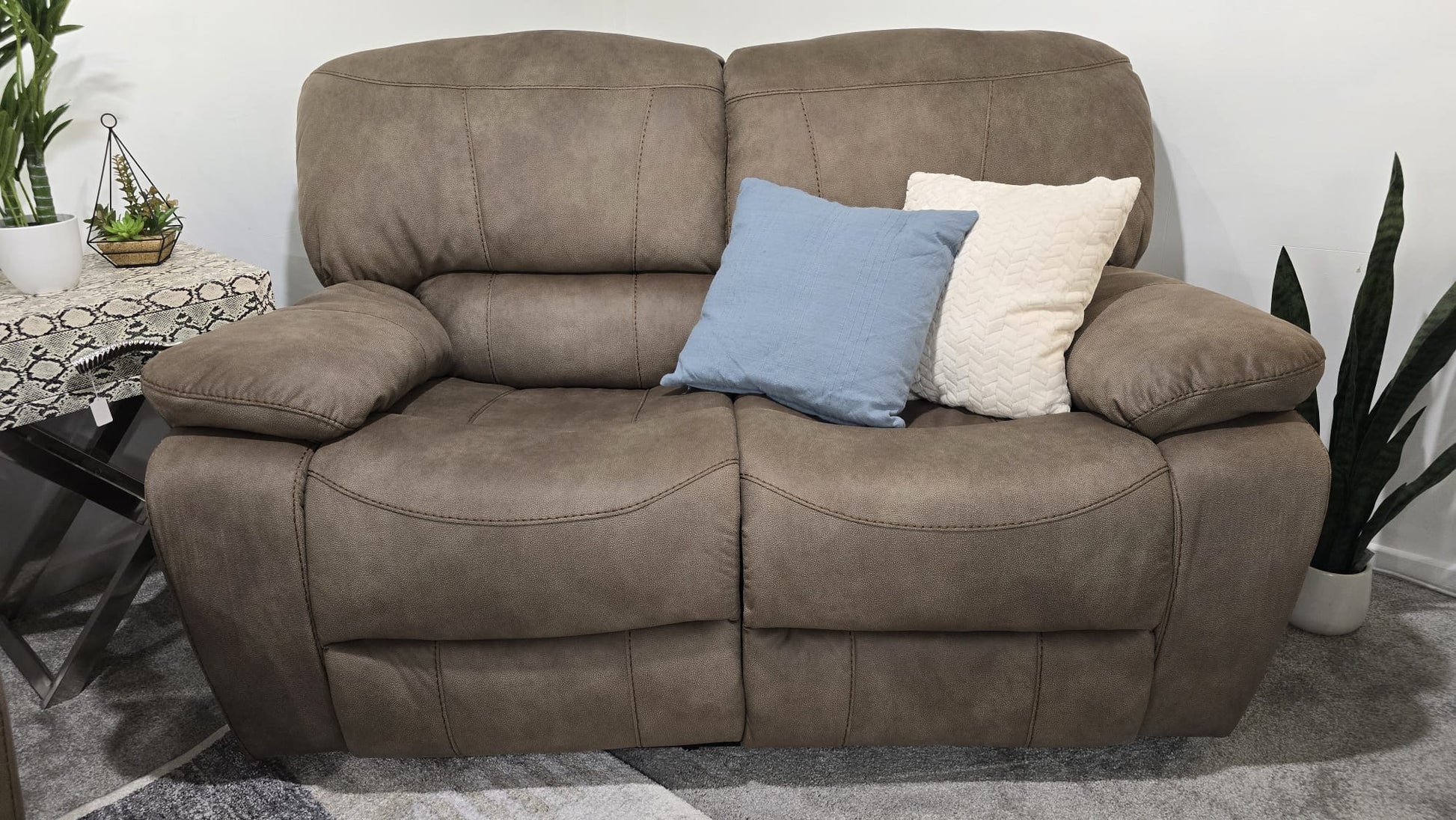 Sandstone Fabric recliner sofa set with cushions in a living room setting