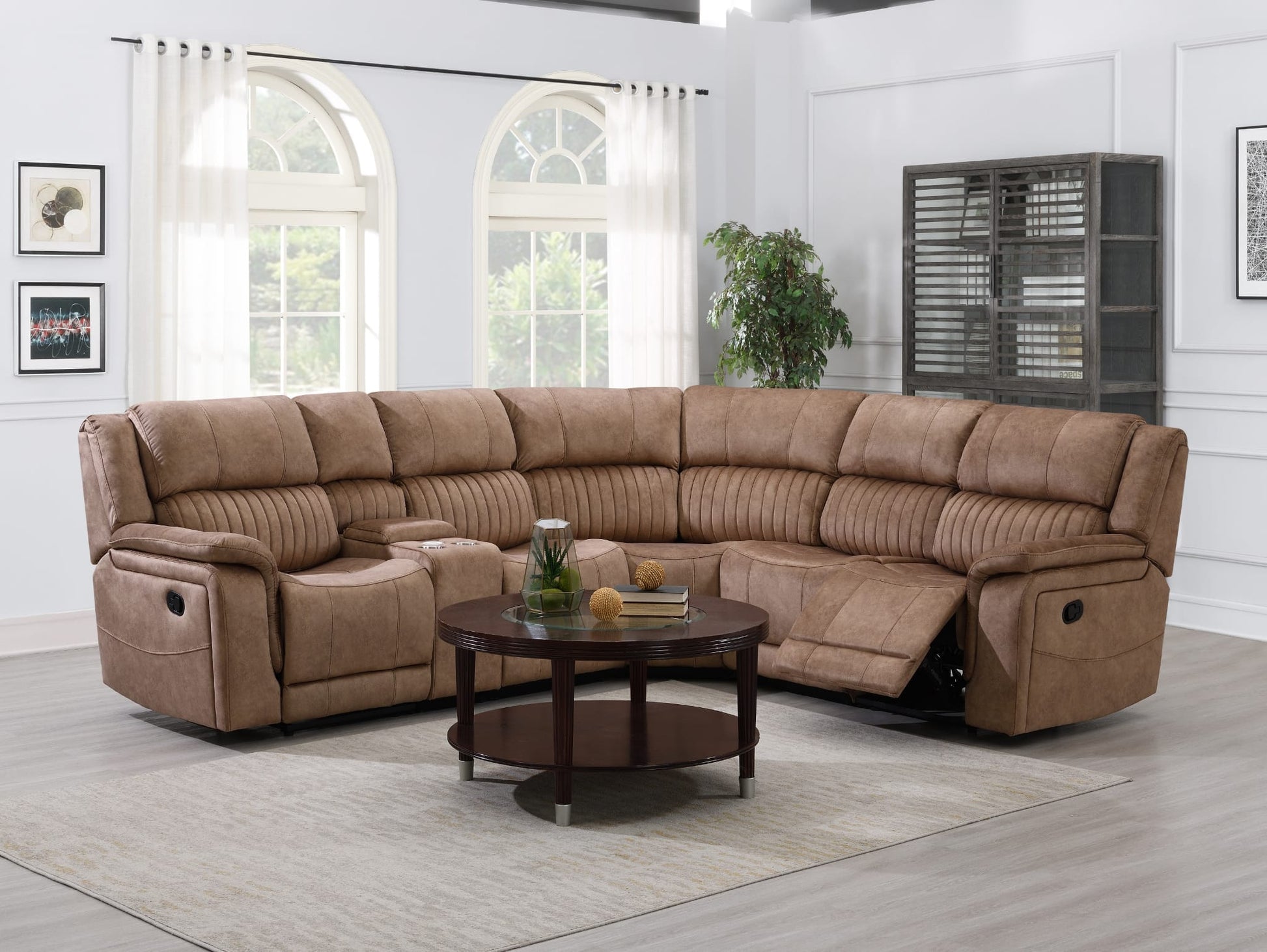 Brown sectional recliner corner sofa in a living room with a coffee table and decor items.