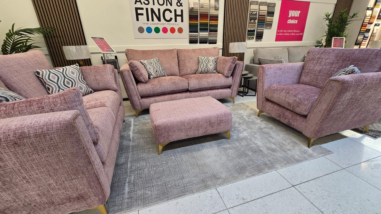 pink fabric sofas in a furniture store display area.