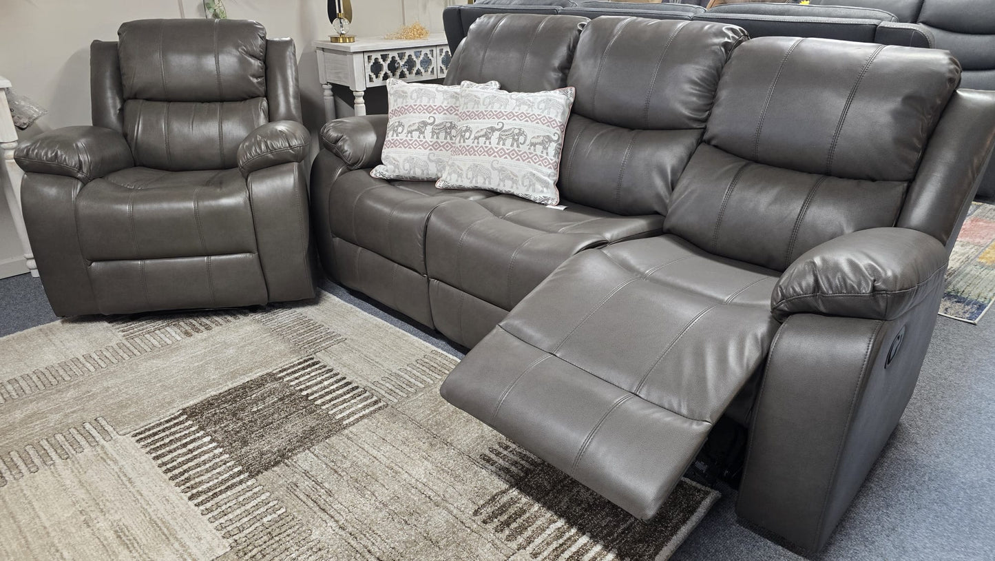 Gray leather reclining sofa set on a carpeted floor