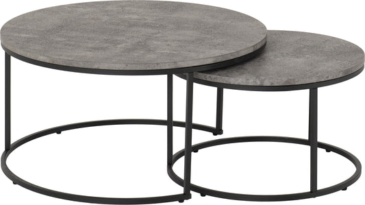 Set of two round coffee tables with gray tops and black metal bases on a white background