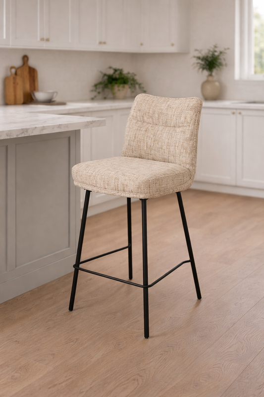 Beige bar stool with black legs in a kitchen setting