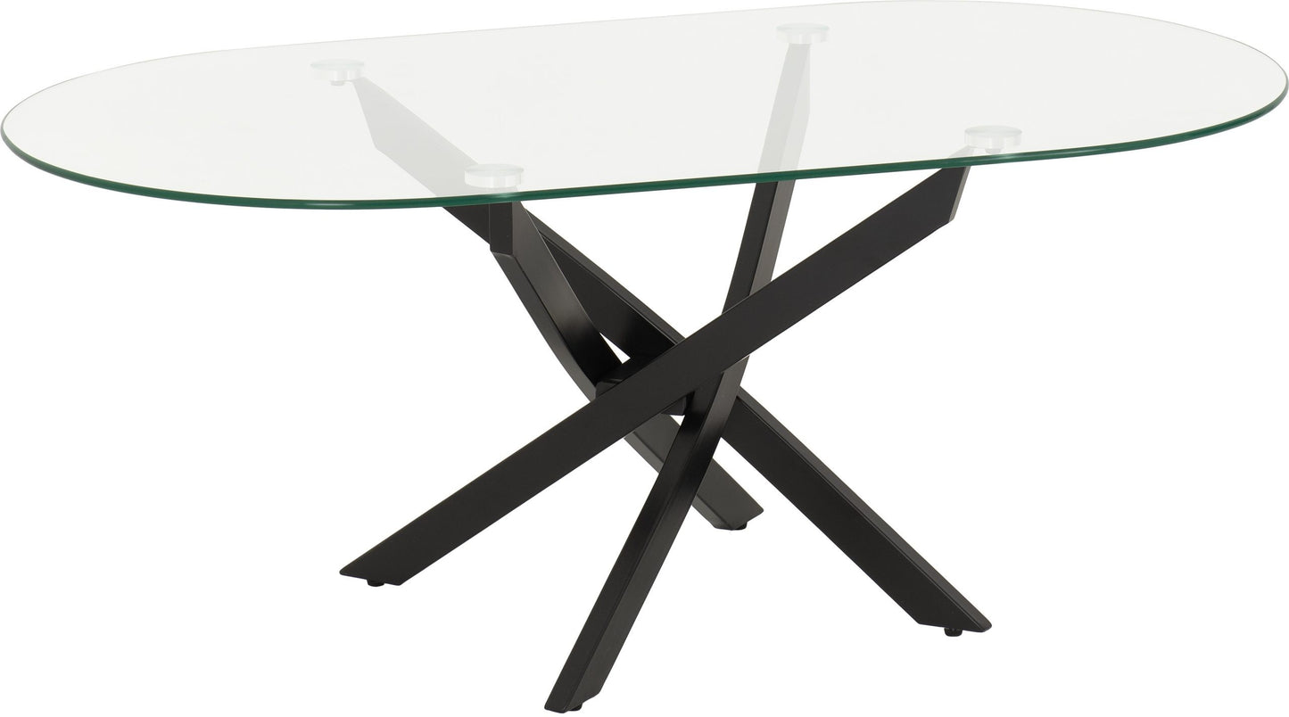 Glass dining table with black metal legs on a white background