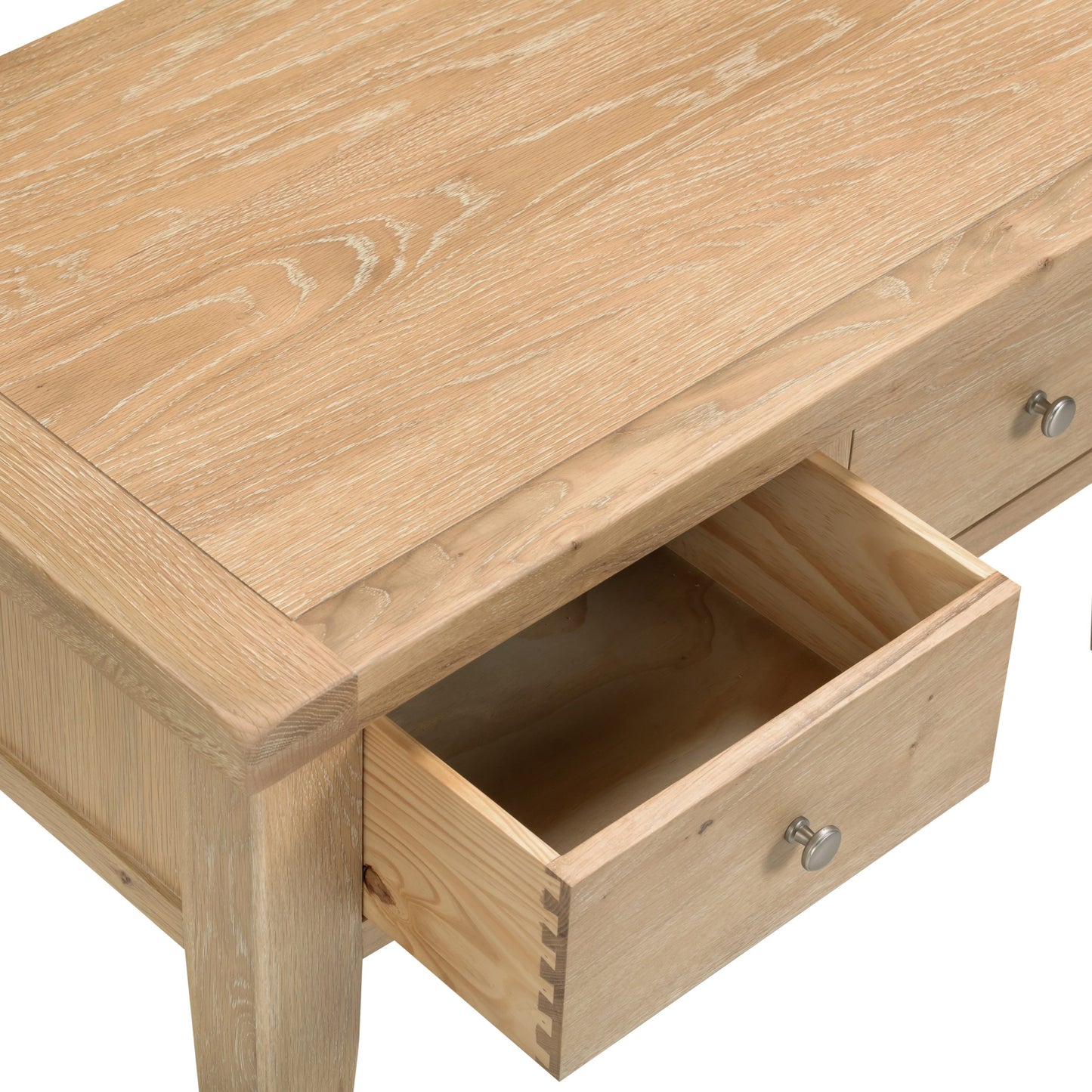 Wooden desk with an open drawer on a white background
