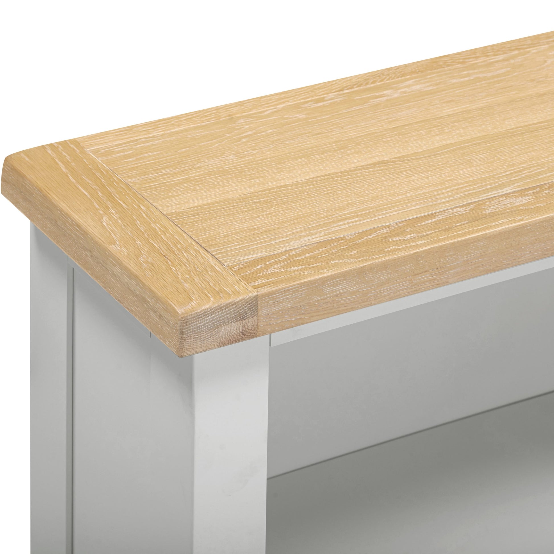 Wooden table top on a metal frame with a plain background